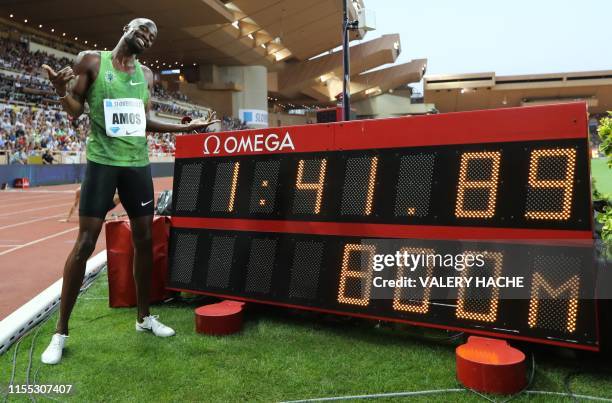 Botswana's Nijel Amos poses with a screen reading his meeting record after winning in the Men's 800m during the IAAF Diamond League competition on...