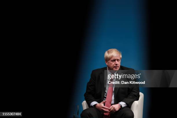 Boris Johnson onstage during the Conservative leadership hustings at Cheltenham Racecourse on July 12, 2019 in Cheltenham, England. Boris Johnson and...