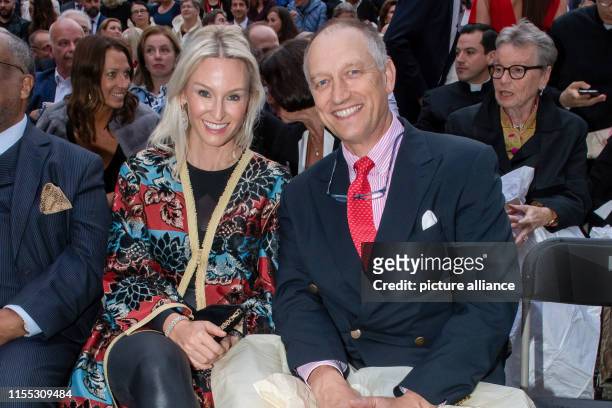 July 2019, Bavaria, Regensburg: Prince Wolfgang and Princess Tatiana of Bavaria are sitting next to Bernd Sibler , Bavarian Minister of State for...