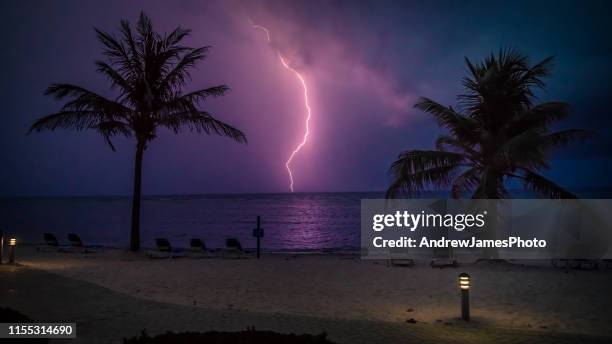 lightning strike over the carribean - lightning strike imagens e fotografias de stock