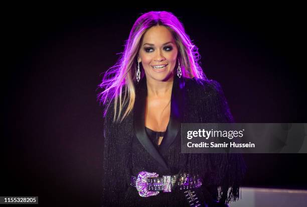 Rita Ora performs at the Sentebale Audi Concert at Hampton Court Palace on June 11, 2019 in London, England. Sentebale charity was founded by Their...
