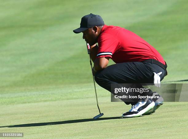 Harold Varner III lines up his putt on the green during the second round of the John Deere Classic Golf Tournament at TPC Deere Run on July 12 at...