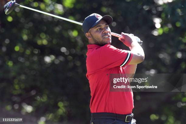 Harold Varner III reacts after hitting his tee shot on the hole during the second round of the John Deere Classic Golf Tournament at TPC Deere Run on...