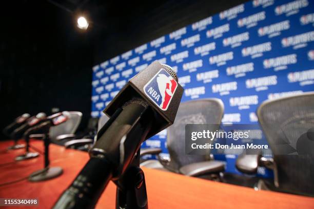 General view of a Microphone with the NBA logo at the post press conference after the Orlando Magic played the Toronto Raptors in Game Three of the...