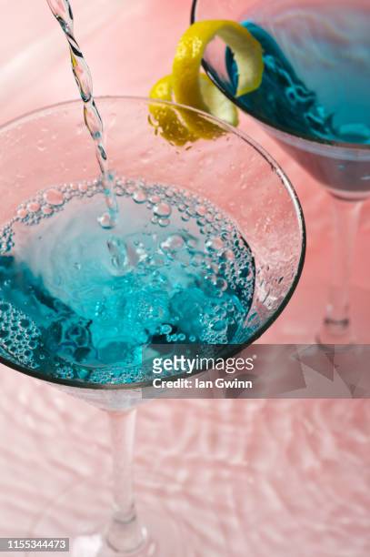 martini glasses in water - ian gwinn stock pictures, royalty-free photos & images