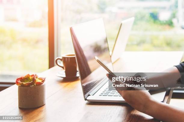 woman using smartphone and laptop. - media 2017 stock pictures, royalty-free photos & images
