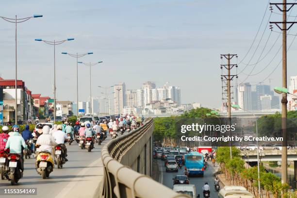 busy traffic in hanoi, vietnam. - hanoi cityscape stock pictures, royalty-free photos & images