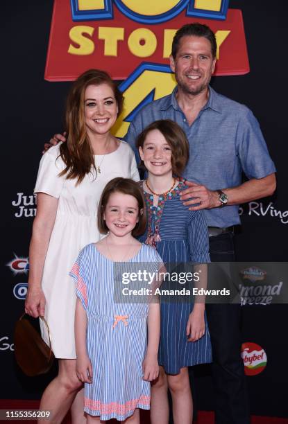 Alyson Hannigan, Alexis Denisof and their daughters Satyana Marie Denisof and Keeva Jane Denisof arrive at the premiere of Disney and Pixar's "Toy...