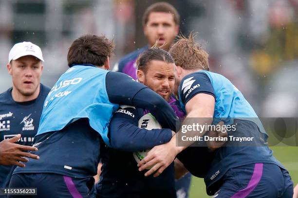 Sandor Earl is tackled during a Melbourne Storm NRL training session at Gosch's Paddock on June 12, 2019 in Melbourne, Australia.