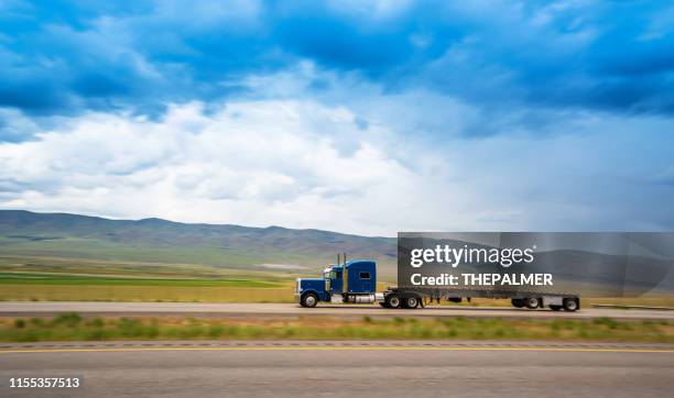 truck on the road - utility trailer stock pictures, royalty-free photos & images