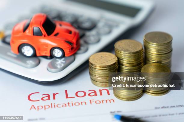 car loan,money, banknote on agreement document or car insurance application form - auto loan stock pictures, royalty-free photos & images