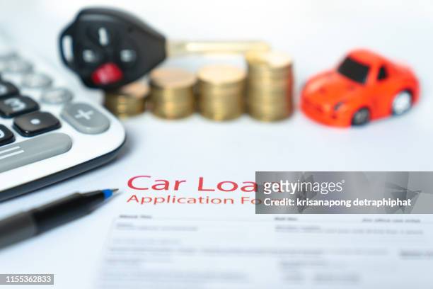 car loan,money, banknote on agreement document or car insurance application form - auto loan stock pictures, royalty-free photos & images