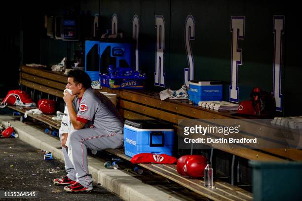 David Hernandez of the Cincinnati Reds sits in the dugout dejected after allowing a pair of eighth inning homeruns and taking the loss against the...