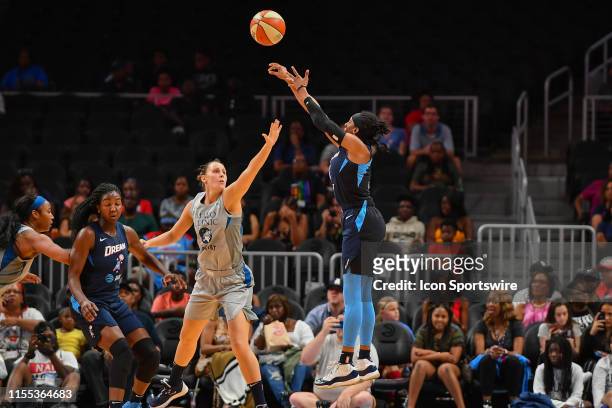 Atlanta's Brittney Sykes takes a three point shot while defended by Minnesota's Stephanie Talbot during the WNBA game between the Minnesota Lynx and...