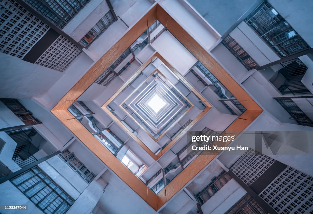 Directly Below Shot Of Modern Building Against Sky