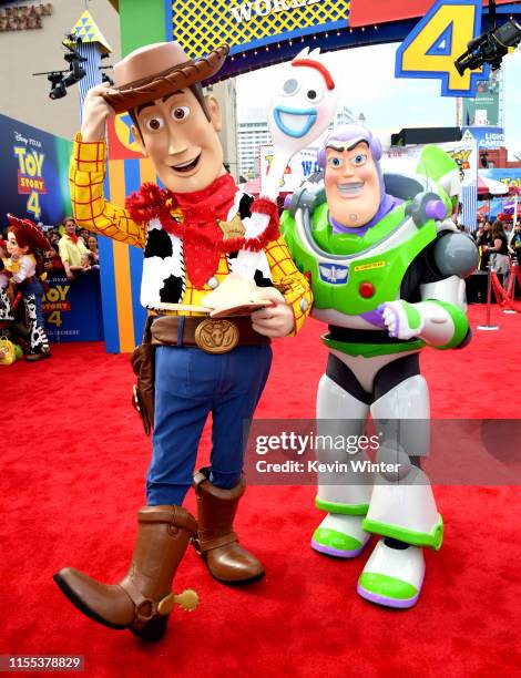 Woody and Buzz Lightyear pose at the premiere of Disney and Pixar's "Toy Story 4" at the El Capitan on June 11, 2019 in Los Angeles, California.
