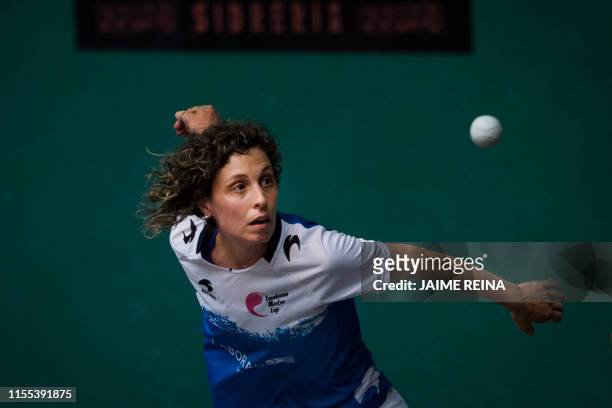 Iera Aguirre returns the ball during the San Fermin women's Basque pelota championship final match at the Fronton Labrit on the sidelines of the San...