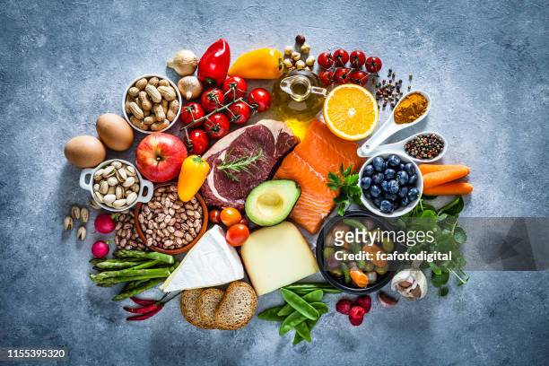 food backgrounds: table filled with large variety of food - food pyramid stock pictures, royalty-free photos & images
