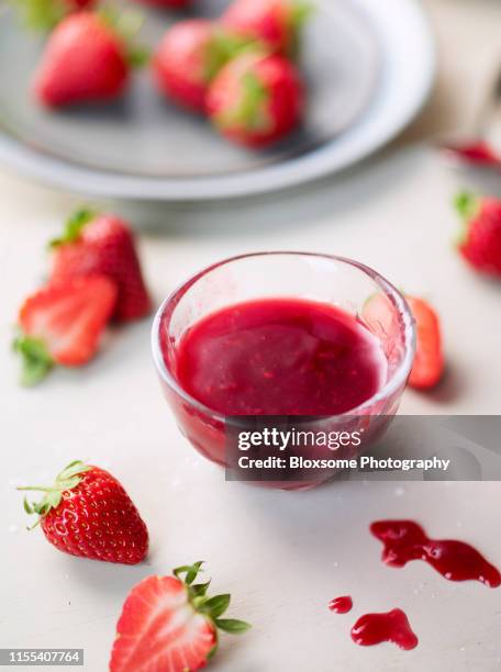 strawberry sauce - strawberry syrup stock pictures, royalty-free photos & images