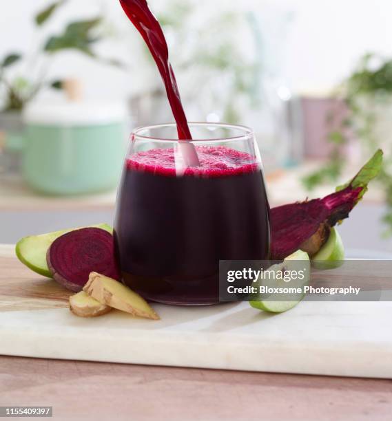 beetroot juice pour - beetroot smoothie stock pictures, royalty-free photos & images