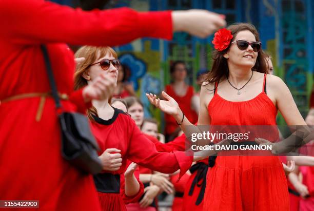 Fans of English singer Kate Bush perform a dance during a flash mob event to mark 'The Most Wuthering Heights Day Ever' in Goerlitzer Park in Berlin...