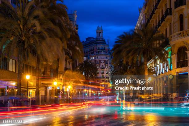 night street view in valencia downtown, spain. palm trees in spanish city of valencia. - valencia stock pictures, royalty-free photos & images