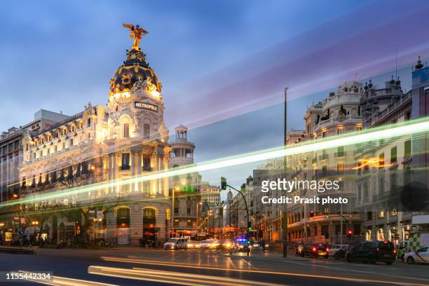 madrid, spain cityscape on gran via at twilight. - madrid stock pictures, royalty-free photos & images