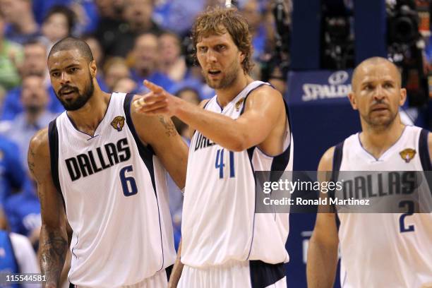 Tyson Chandler, Dirk Nowitzki and Jason Kidd of the Dallas Mavericks look on against the Miami Heat in Game Four of the 2011 NBA Finals at American...