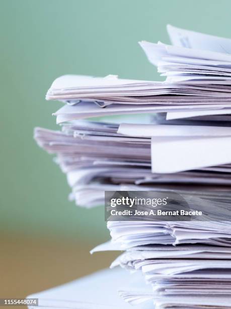 pile of papers on a work table. - debiteuren stockfoto's en -beelden