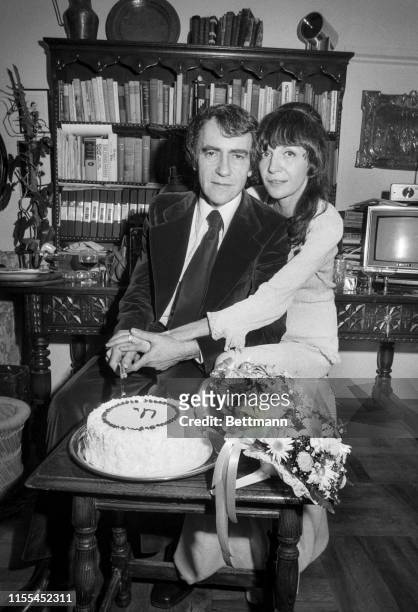 Producer Joseph Papp and his bride, Gail Merrifield, the great-granddaughter of John Wilkes Booth, cuts their wedding cake after they were married....