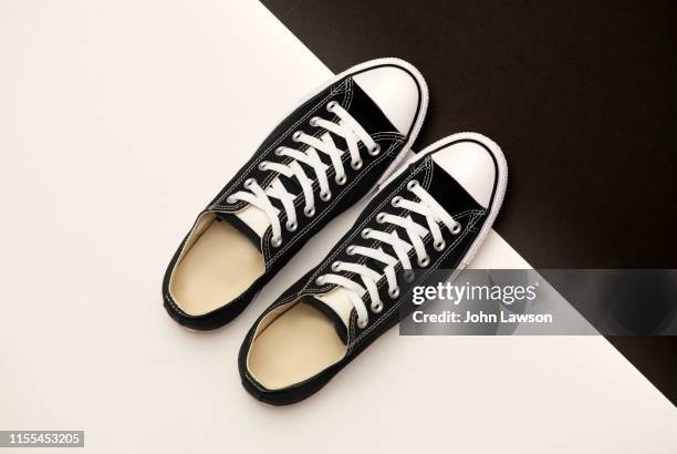 black sneakers - black shoe ストックフォトと画像