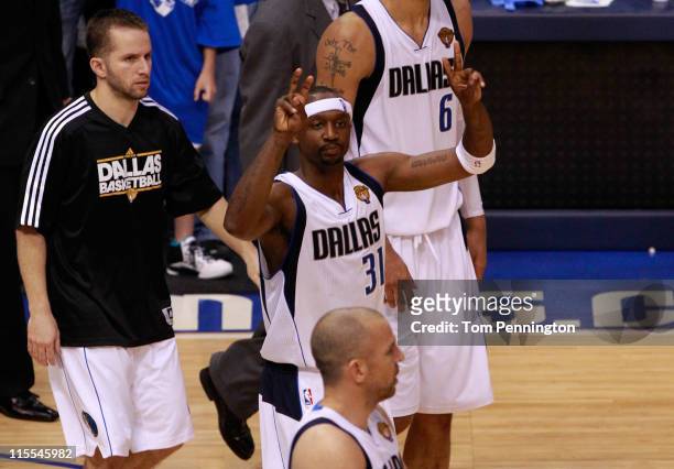 Jason Terry and Jose Juan Barea of the Dallas Mavericks celebrate after they won 86-83 against the Miami Heat in Game Four of the 2011 NBA Finals at...