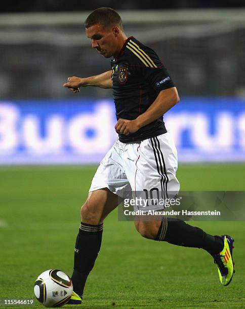 Lukas Podolski of Germany runs with the ball during the UEFA EURO 2012 qualifying match between Azerbaijan against Germany at Tofig-Bahramov-Stadium...