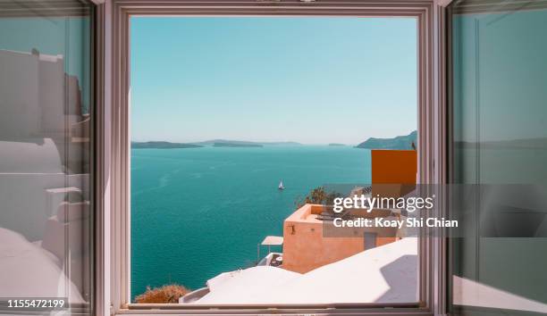 beautiful sea view window - greece city foto e immagini stock