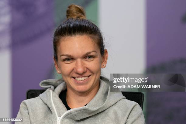 Romania's Simona Halep gives a press conference after winning the women's singles final on day twelve of the 2019 Wimbledon Championships at The All...