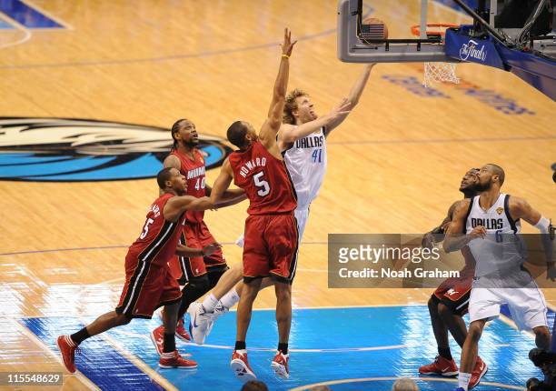 Dirk Nowitzki of the Dallas Mavericks shoots against Juwan Howard of the Miami Heat during Game Four of the 2011 NBA Finals on June 7, 2011 at the...