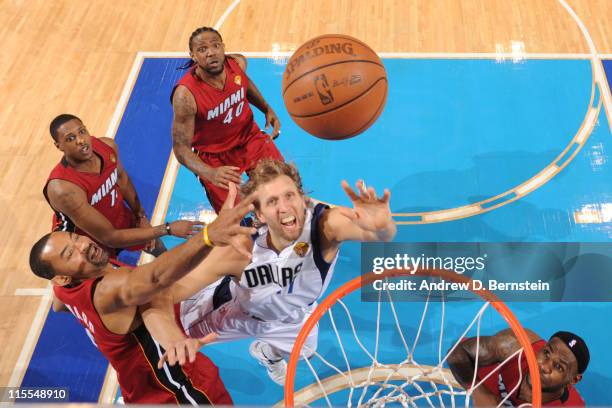 Dirk Nowitzki of the Dallas Mavericks shoots against Juwan Howard of the Miami Heat during Game Four of the 2011 NBA Finals on June 7, 2011 at the...