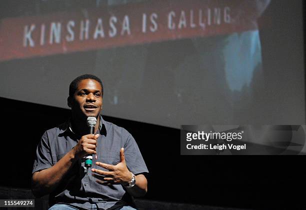 Director Djo Munga speaks with the audience during a question and answer session after a screening of the Founder Of New African Empower Suzanne...