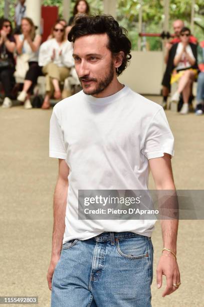 Italian Designer Marco de Vincenzo acknowledges the applause of the public after the Marco De Vincenzo fashion show during Pitti Immagine Uomo 96 on...