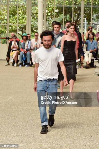 Italian Designer Marco de Vincenzo acknowledges the applause of the public after the Marco De Vincenzo fashion show during Pitti Immagine Uomo 96 on...