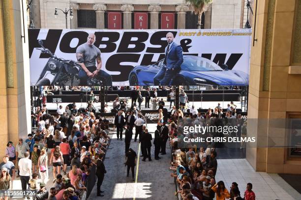 People line up to watch the stars arrive for the World premiere of "Fast & Furious Presents: Hobbs and Shaw" at the Dolby theatre on July 13, 2019 in...