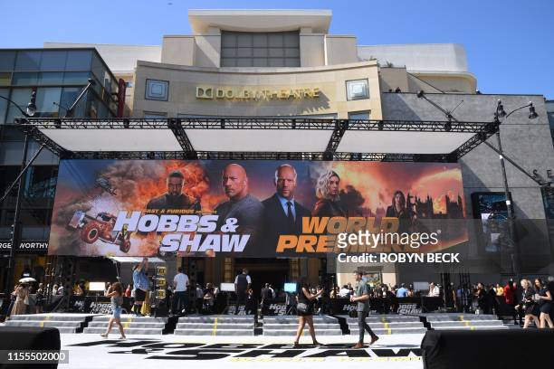 People get ready to watch the stars arrive for the world premiere of "Fast & Furious Presents: Hobbs and Shaw" at the Dolby theatre on July 13, 2019...