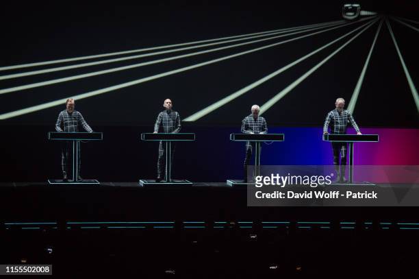 Ralf Hütter, Fritz Hilpert, Henning Schmitz and Falk Grieffenhagen of Kraftwerk perform at Cite de la Musique on July 13, 2019 in Paris, France.