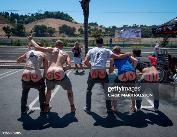 Residents of Laguna Niguel expose their buttocks to a passing Metrolink train during the annual "Mooning of the trains" event along a stretch of...