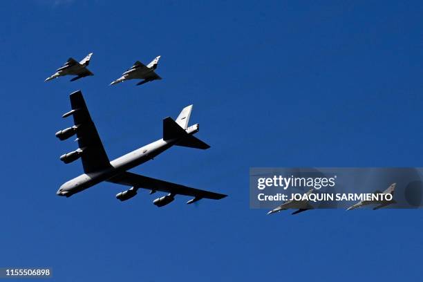 Colombian Air Force pilots on Kfir and B-52 airplanes perform aerobatics during for the commemoration of the 100th anniversary of the Colombian Air...