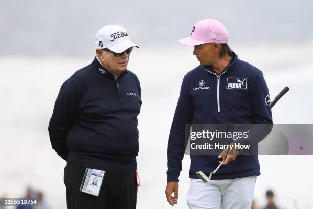 Player instructor, Butch Harmon , and Rickie Fowler of the United States talk during a practice round prior to the 2019 U.S. Open at Pebble Beach...
