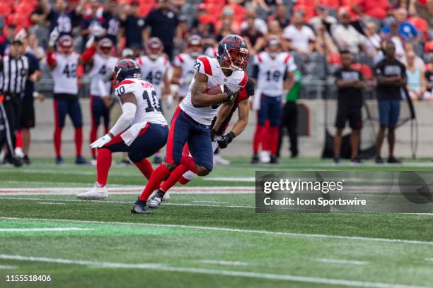 Montreal Alouettes defensive back Tommie Campbell runs with the football during Canadian Football League action between the Montreal Alouettes and...