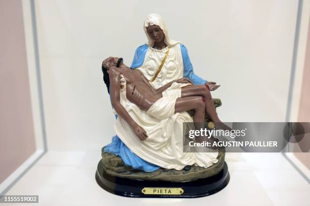 This photo taken on July 11, 2019 shows a reinterpretation of Michelangelo Buonarroti's Pieta during the "Linda Vallejo: Brown Belongings" exhibit at...