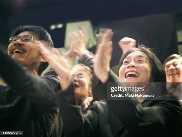 they are standing ovation with smile - ovación de pie fotografías e imágenes de stock