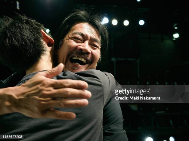 two men are hugging and celebrating joy - incoraggiamento foto e immagini stock